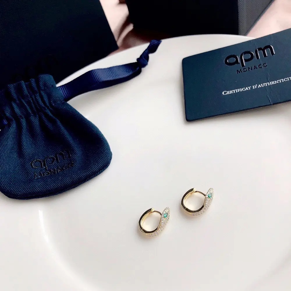 Apm monaco gold and silver snake-shaped earrings