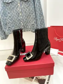 Roger Vivier Metal Buckle Chelsea Boots. The brand style is interpreted with consistent