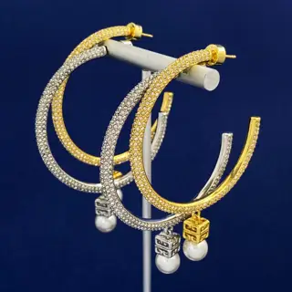 Givenchy’s atmospheric diamond-studded C-shaped hanging hollow polished three-dimensional