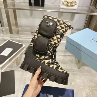The latest PRADA: A quirky soft lambskin tongue with an embroidered Prada logo adds a touch