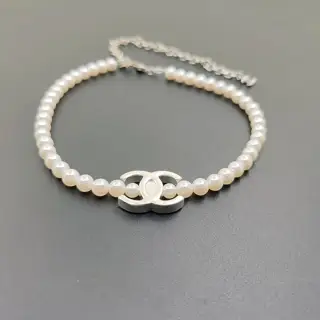 Chanel white gold cc pearl necklace