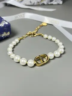 Dior bracelets reinterpret the House’s classic design with a modern twist. Made from white