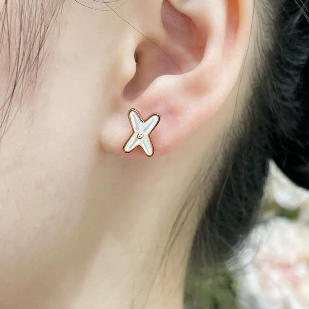 Chaumet cross white shell earrings