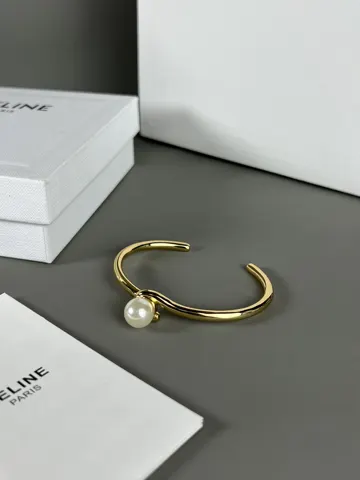 Celine twisted bracelet is very textured when worn. The simple design is engraved with