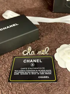 Chanel asymmetrical letter earrings