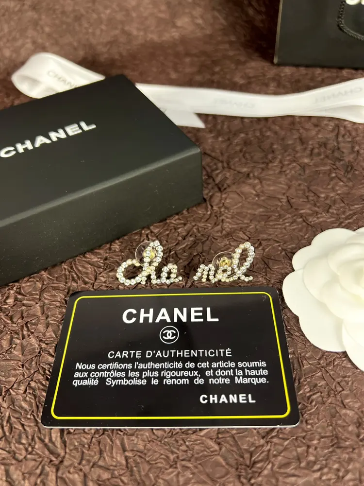 Chanel asymmetrical letter earrings
