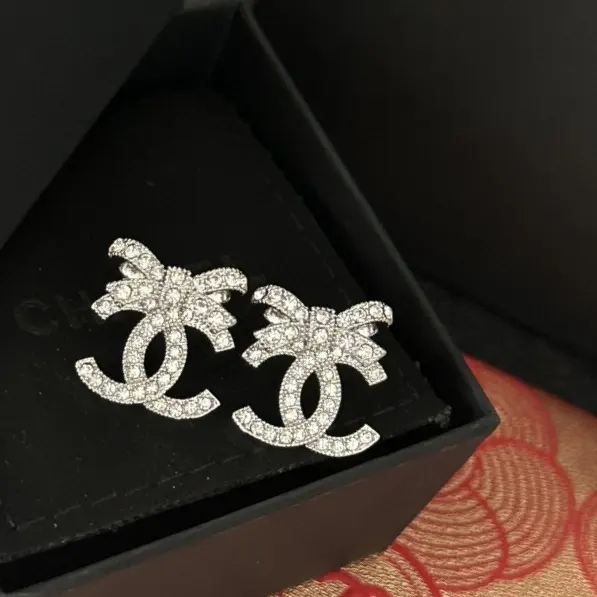 Chanel small bow double c earrings