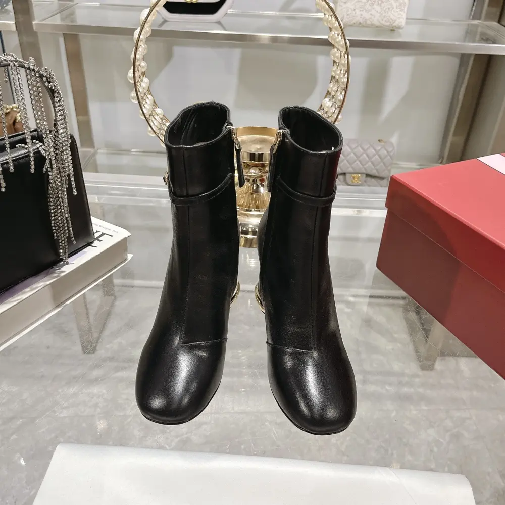 Roger Vivier’s exquisite buckle is like a ring embellished on the trapezoidal heel of this