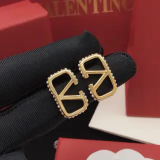 Valentino earrings with V-shaped glossy pearl edging