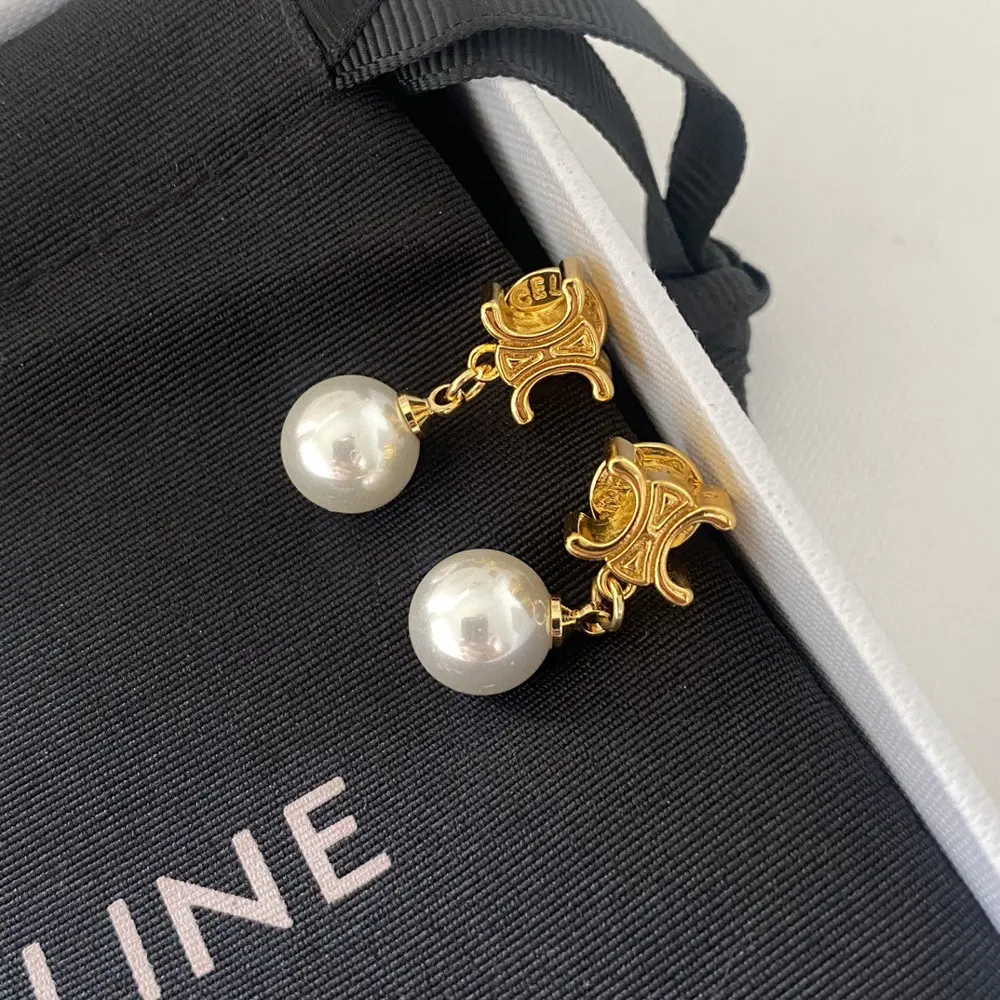 Celine hand-carved letter pearl earrings
