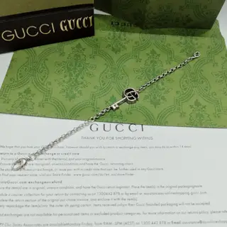 This GUcci bracelet has a distressed effect and cleverly incorporates a chic key design