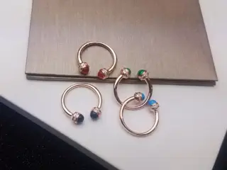 PIAGET has two cabochons of black agate/carnelian/malachite/turquoise and a diamond-paved