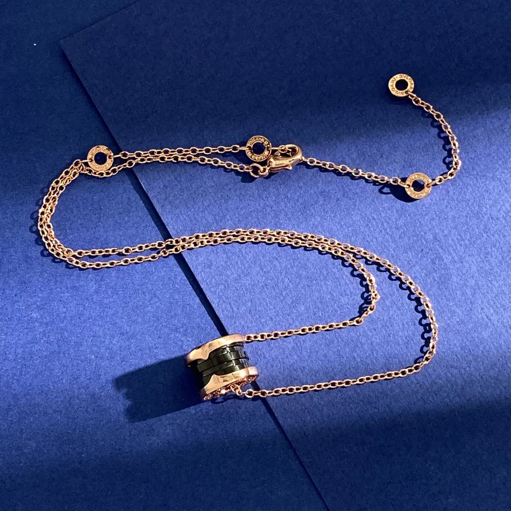 Bvlgari classic fashion rose gold black ceramic small waist spring cylinder pendant