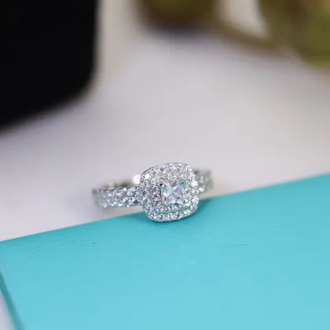 Tiffany channel-set round brilliant-cut diamond ring. The broken diamonds are classic