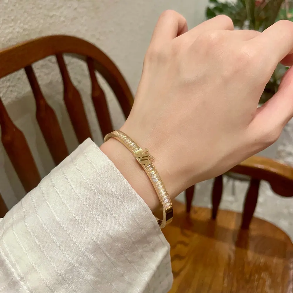 Louis Vuitton diamond-studded letter bracelet