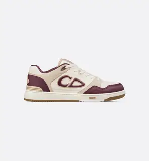 Dior B57 mid-top sneakers are crafted from smooth black and cream leather with beige suede