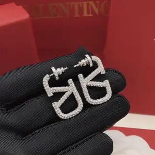 Valentino V-shaped earrings in silver with diamonds