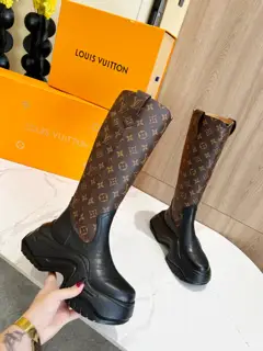 Louis Vuitton grained cowhide uppers are connected to wavy rubber outsoles with LV studs