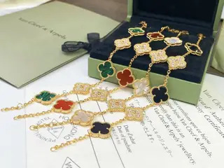 Van Cleef & Arpels black agate/red agate/white mother-of-pearl/malachite with diamond