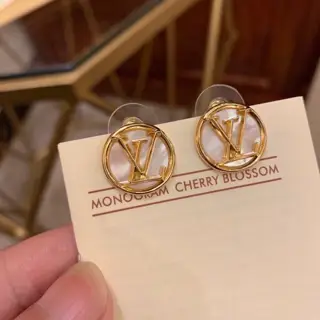Louis Vuitton white shell earrings with lettering