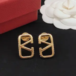 Valentino V-shaped earrings with polished diamond edging