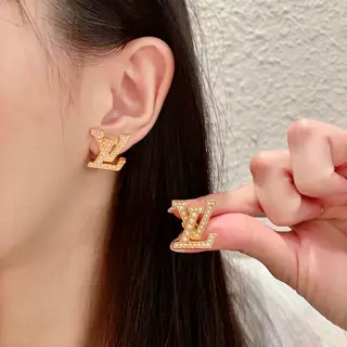 Louis Vuitton vintage letter earrings
