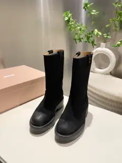 Miumiu boots are wide