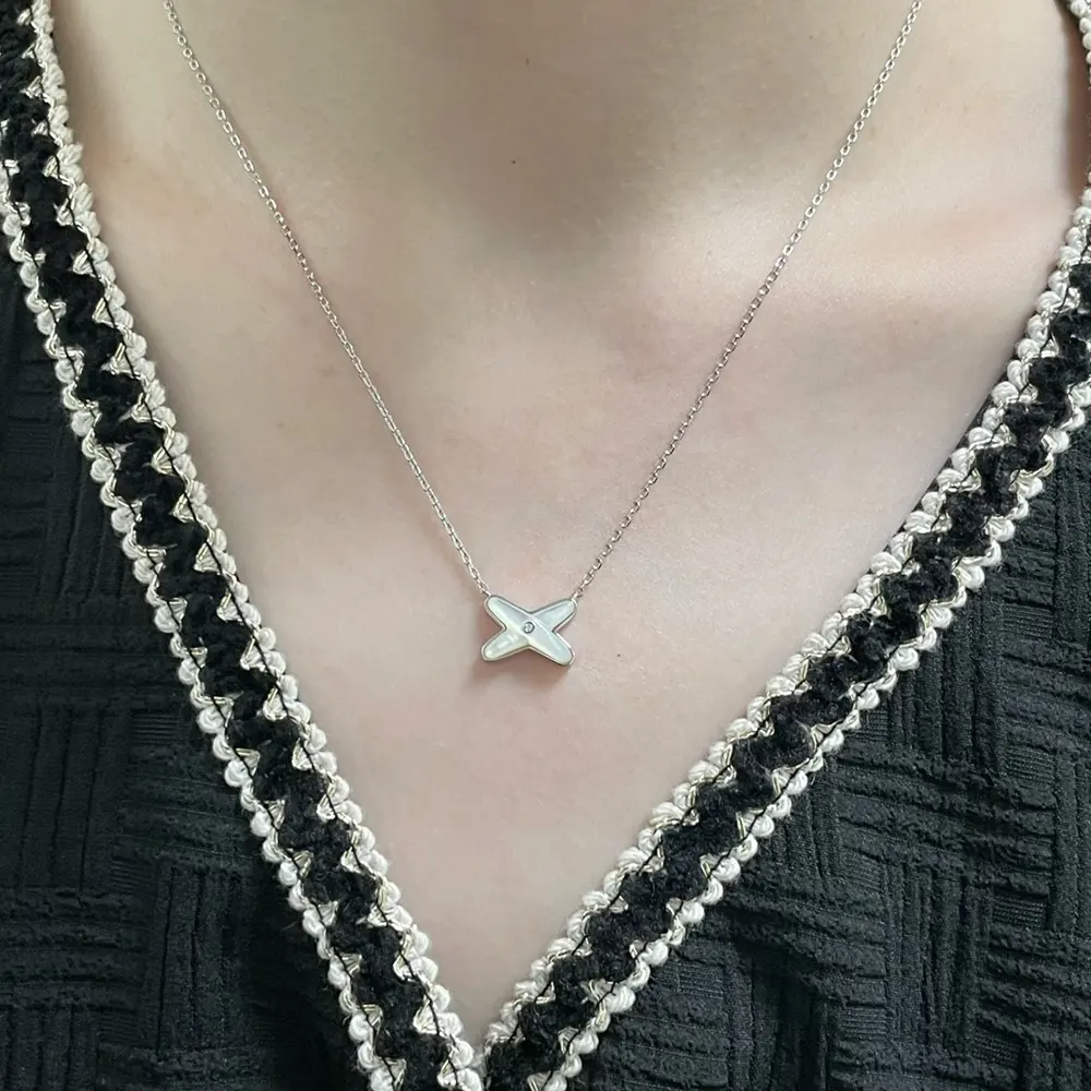 Chaumet cross-over white shell necklace