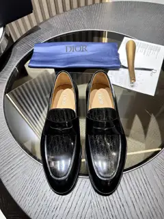 The Dior Granville loafer is a modern take on the dress shoe. Crafted in beige and black