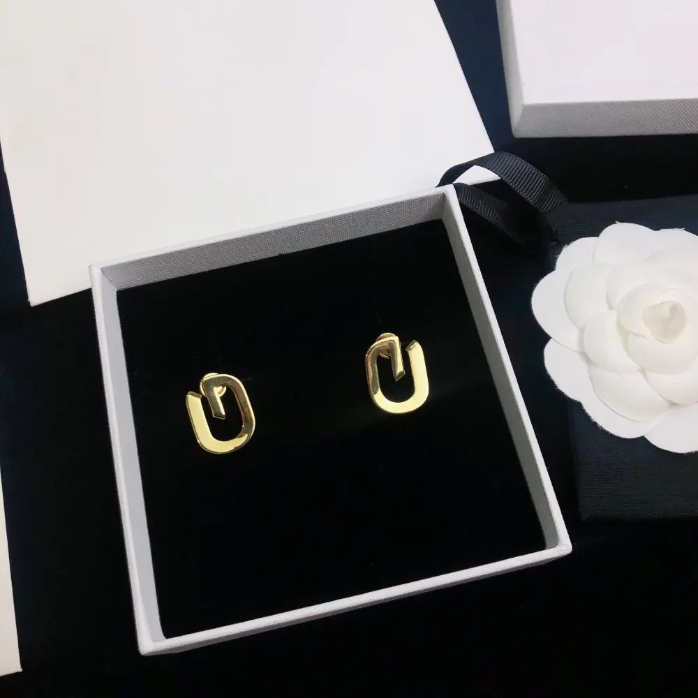 Givenchy G letter earrings. I love the infinity symbol