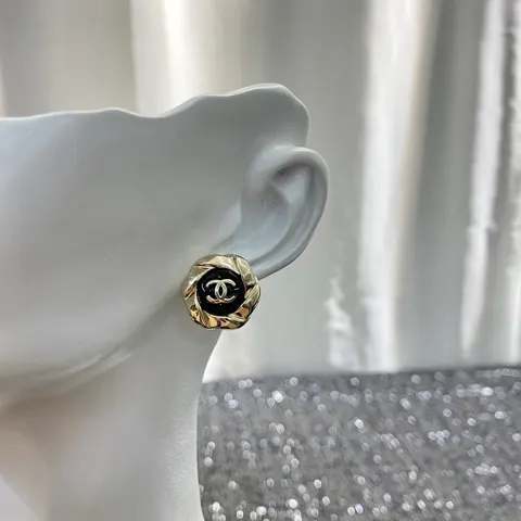 Chanel vintage black and gold camellia earrings