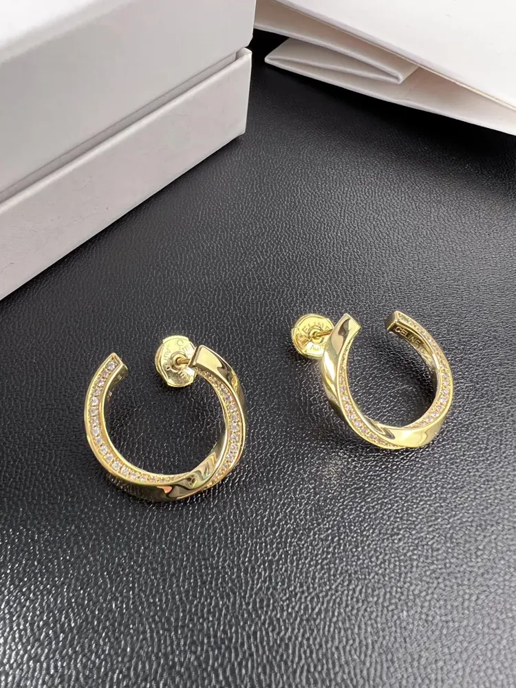 celine twisted half diamond earrings