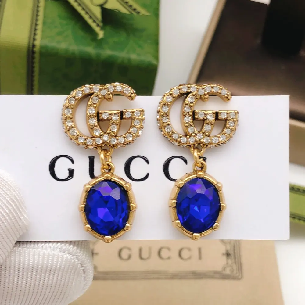 Gucci Double G blue earrings The highly recognizable Double G logo with a big gem Different