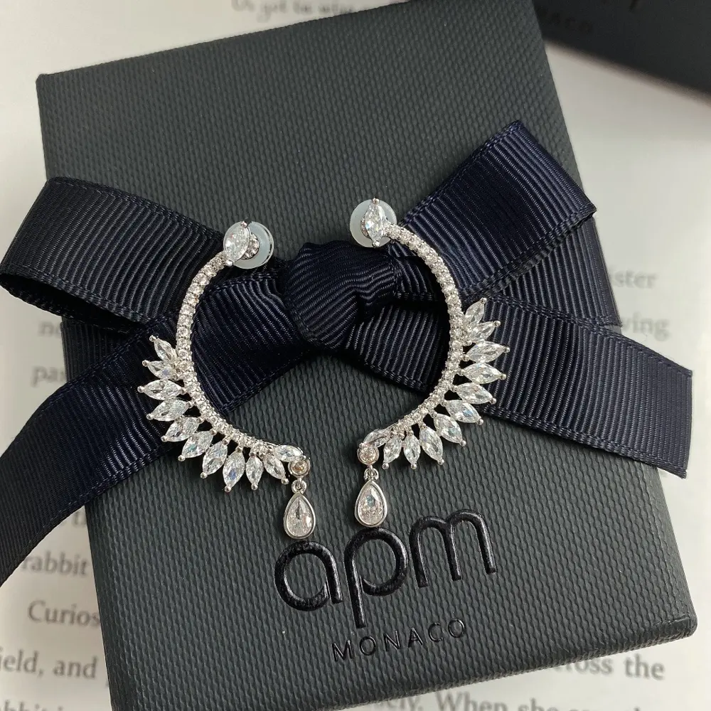 Apm monaco gear-shaped lace earrings