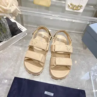 Prada sheepskin sandals combine sporty elements to create a unique fashion statement
