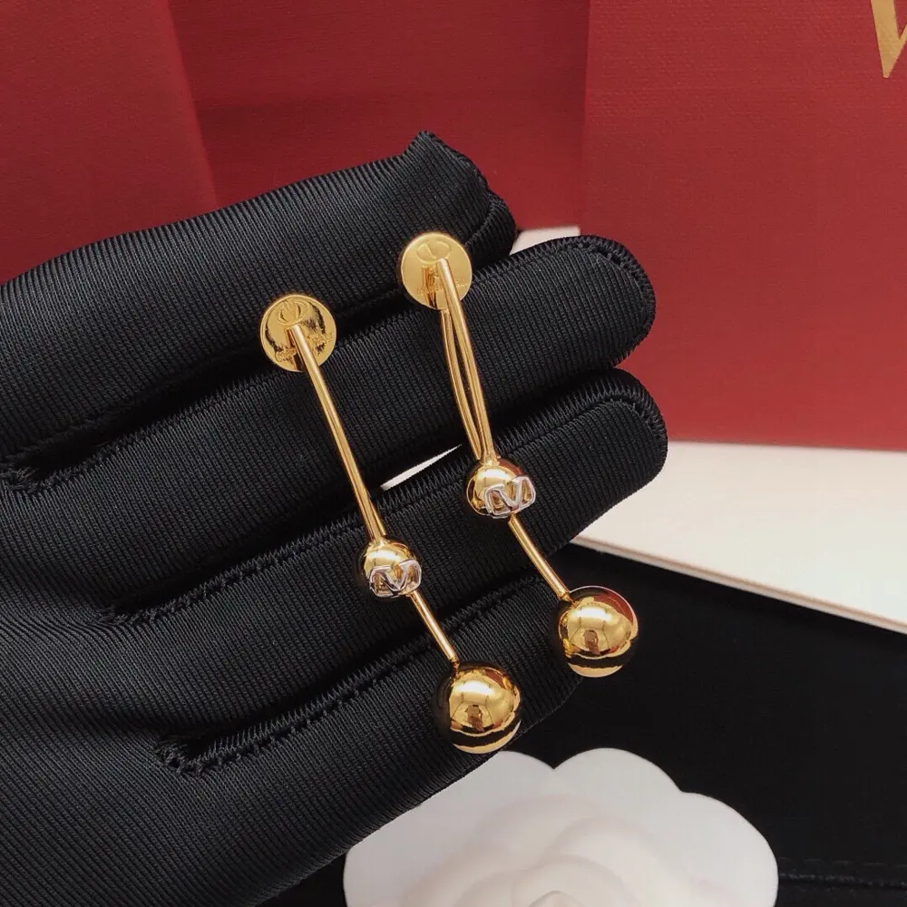 Valentino earrings tassel ball glossy