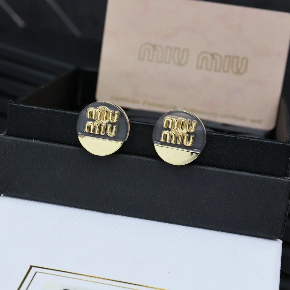 miumiu acrylic gold earrings