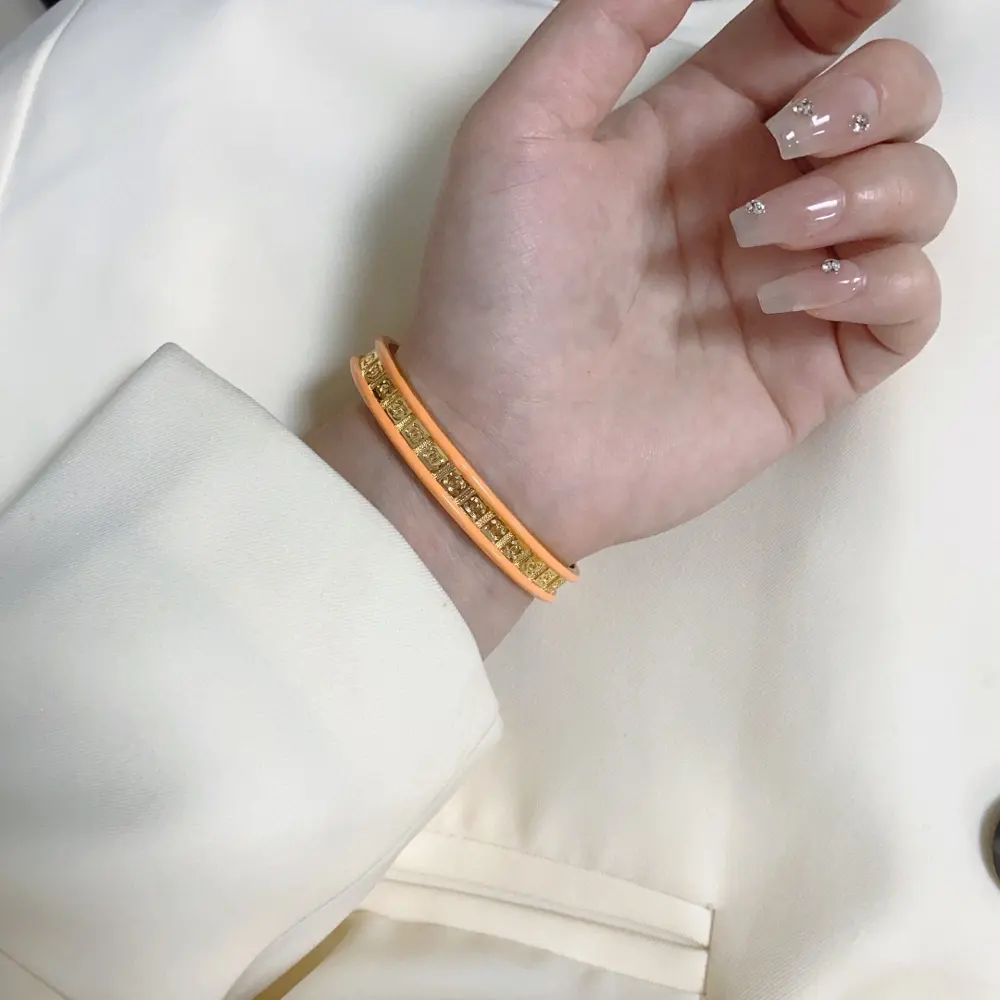 Chanel double C logo engraved orange bracelet