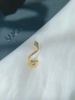 Apm monaco white gold snake and gold snake ear clips are a must-have for fashionistas