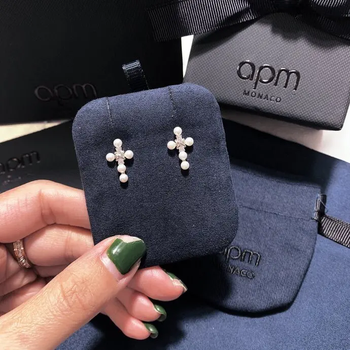 APM Monaco’s new cross pearl earrings