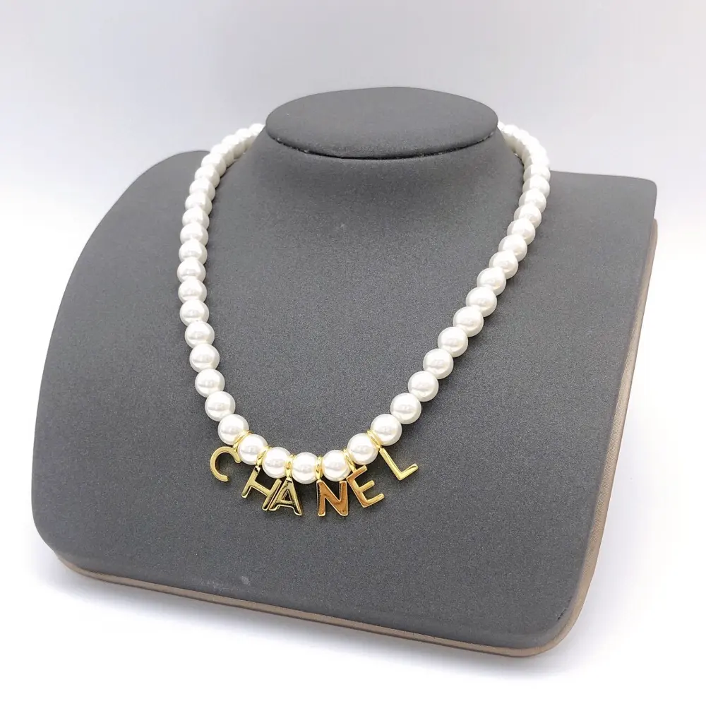 Chanel pearl letter necklace