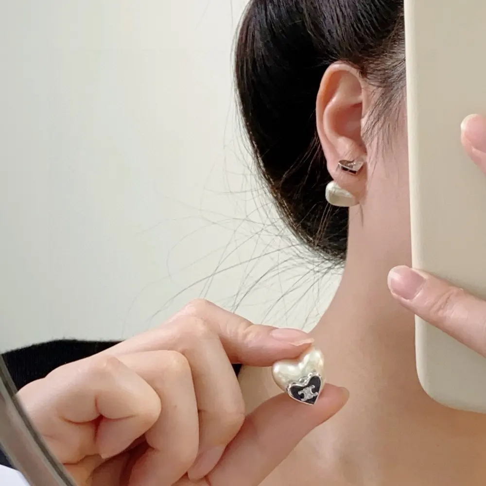 Celine Arc de Triomphe heart earrings