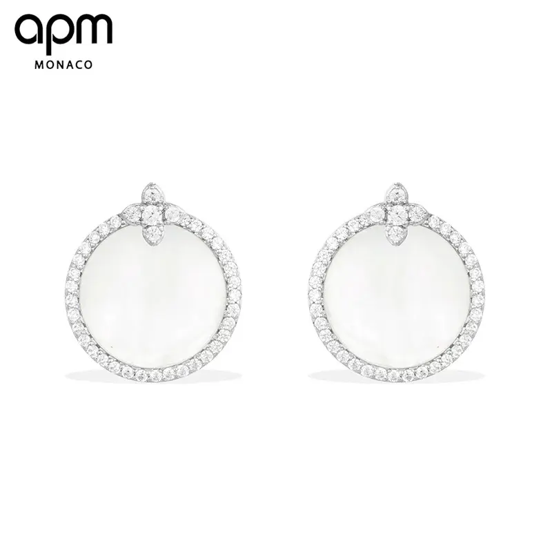 Apm monaco white shell star earrings can be worn in many ways