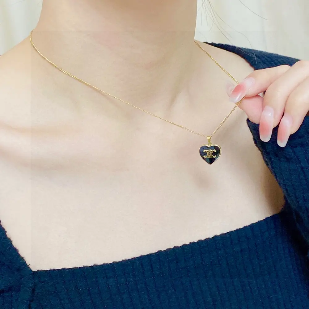 Celine Arc de Triomphe pendant black heart necklace