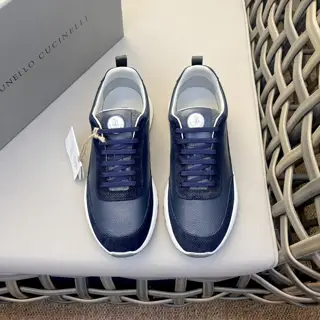 Brunello Cucinelli color-blocked sports flats for men. This pair of flat sports shoes