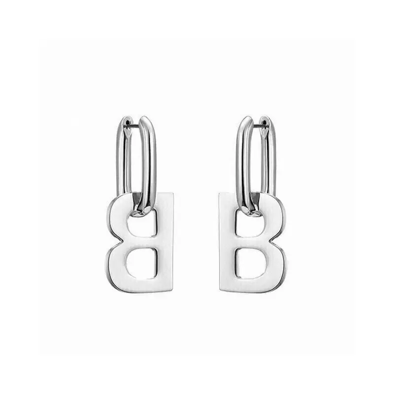 Balenciaga gold stud earrings