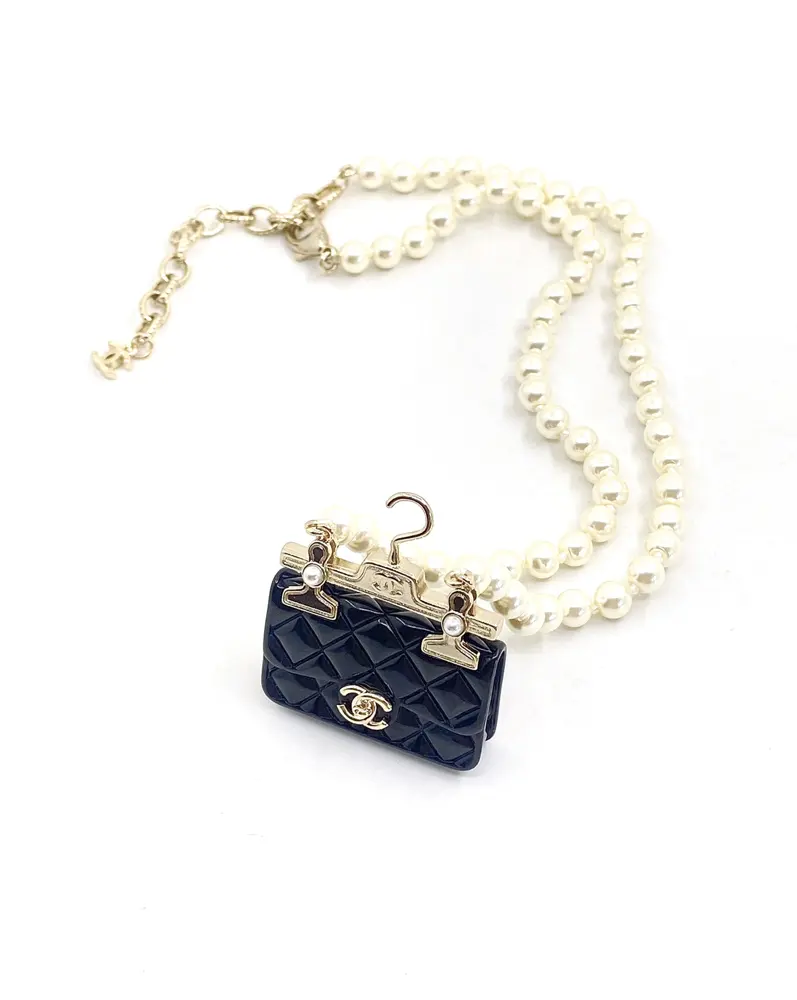 Chanel black bag necklace