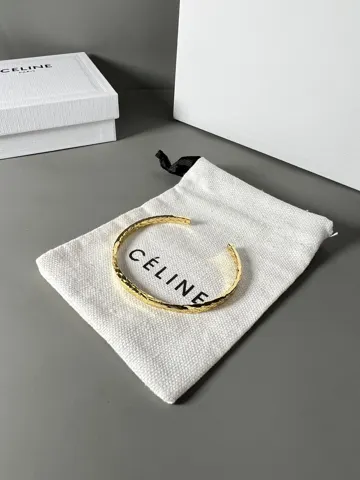 Celine twisted bracelet is very textured when worn. The simple design is engraved with