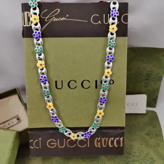Gucci’s new Interlocking Double G green enamel flower anchor chain necklace is decorated