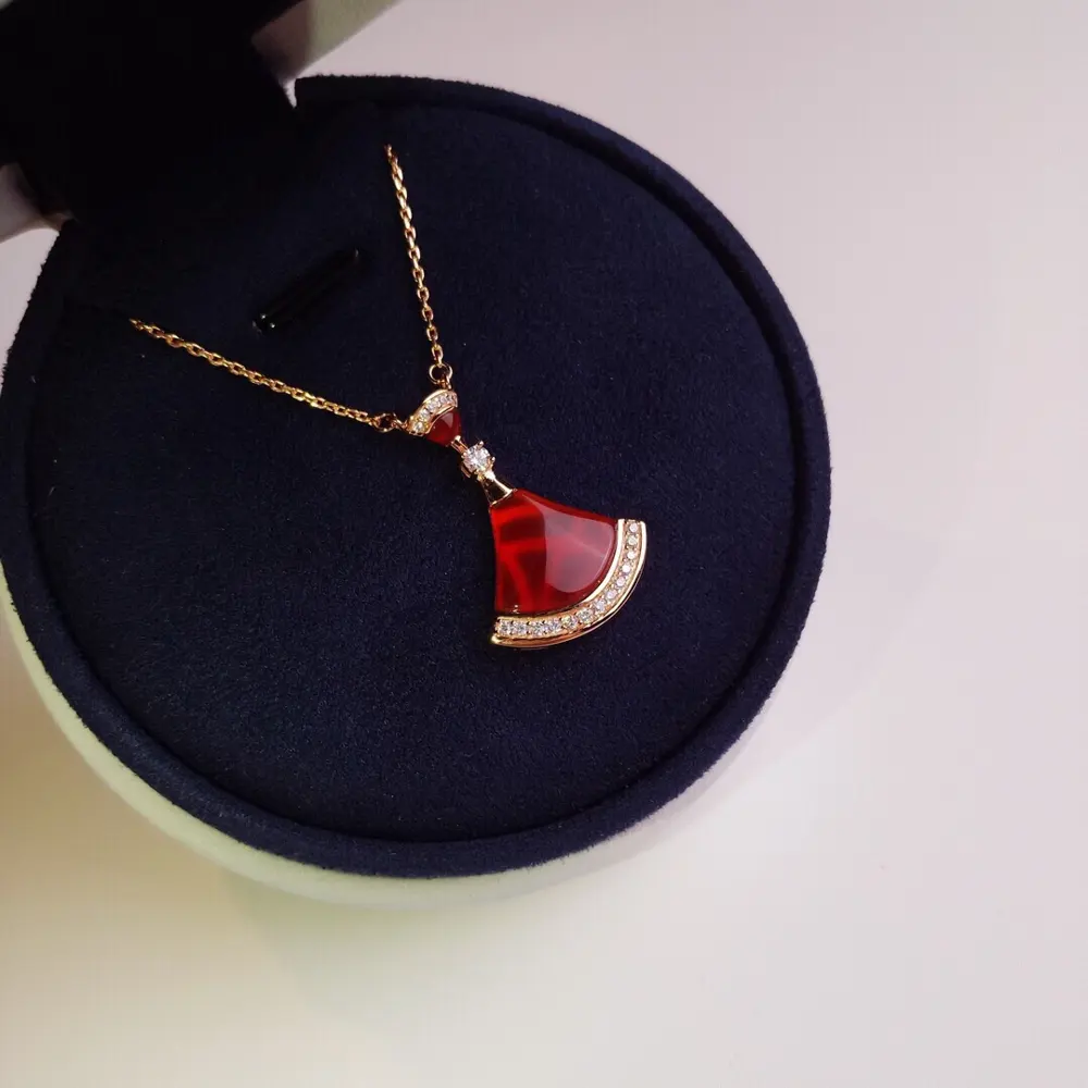 Bvlgari natural stone red agate fan necklace. 18K gold plated material